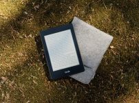 Kindle e-book reader on gray flip cover case