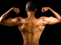 topless man with black background